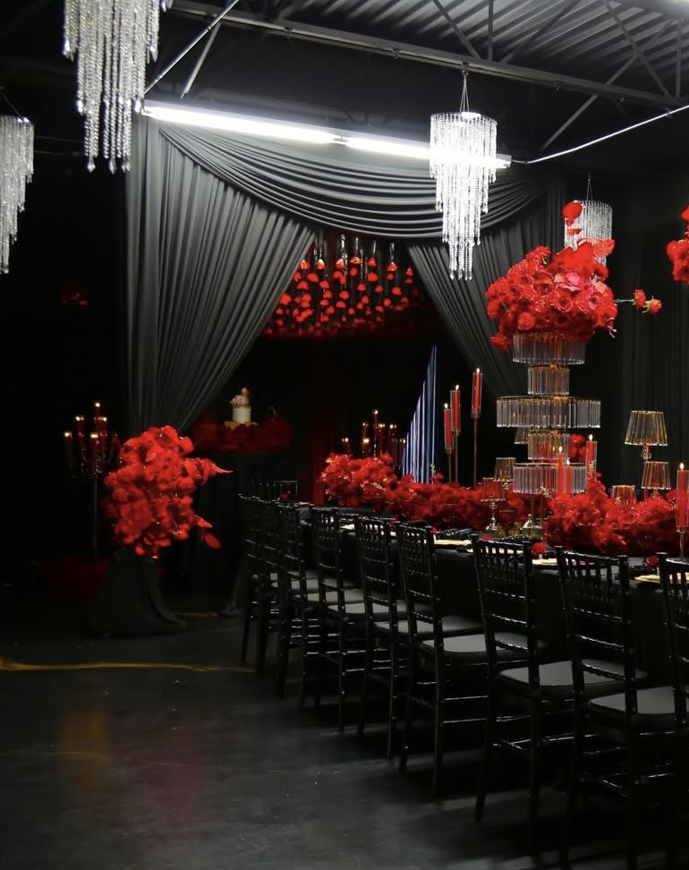 Dramatic black draping and red rose event design by Lavish Events by Talia